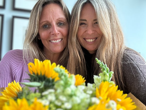 Bouquet of fresh sunflowers delivered same day with friends smiling